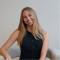 Alexis Briggeman - smiling woman with long blonde hair