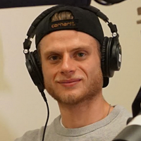 John-Michael Ellis - blonde man wearing headphones